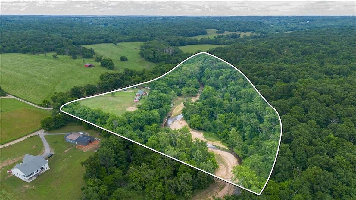 18.1 Acres of Land with Home for Sale in Gravette, Arkansas