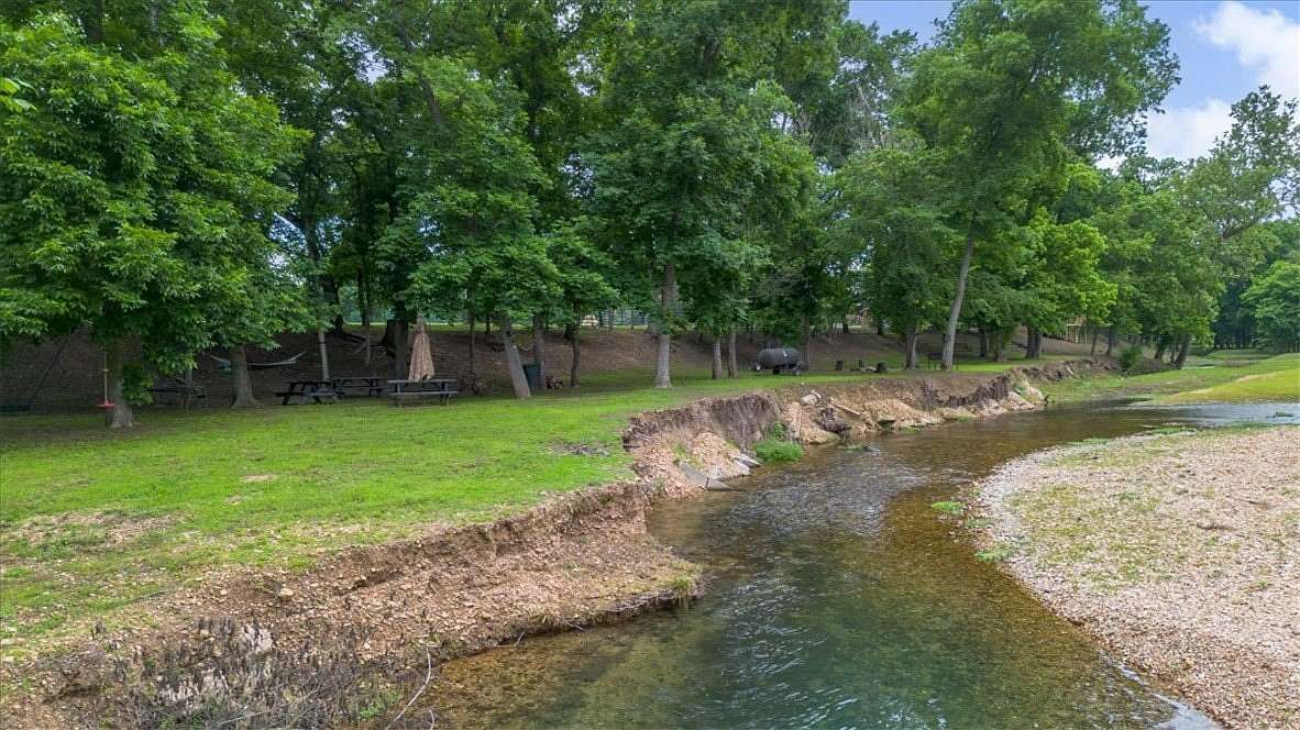 18.1 Acres of Land with Home for Sale in Gravette, Arkansas