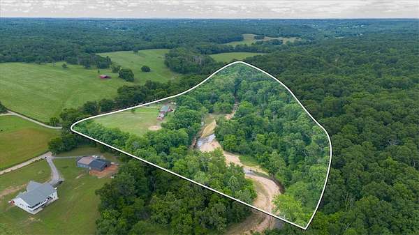 18.1 Acres of Land with Home for Sale in Gravette, Arkansas