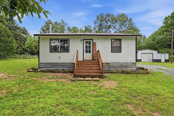 7.12 Acres of Land with Home for Sale in Quitman, Arkansas