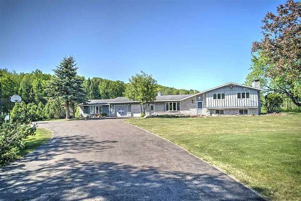 16 Acres of Land with Home for Sale in Bessemer, Michigan