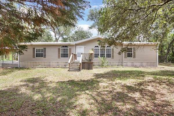 1.86 Acres of Land with Home for Sale in Chiefland, Florida