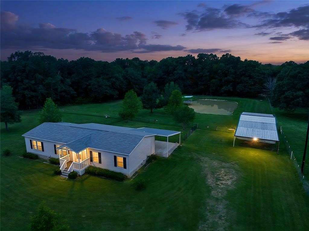 2.39 Acres of Land with Home for Sale in Arthur City, Texas