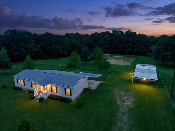 2.39 Acres of Land with Home for Sale in Arthur City, Texas