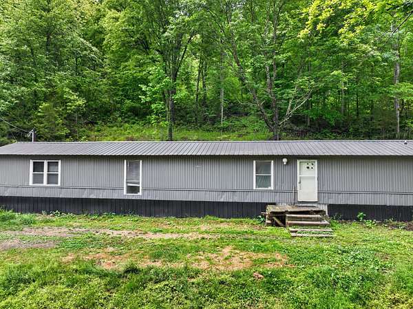 6.9 Acres of Land with Home for Auction in Liberty, Tennessee