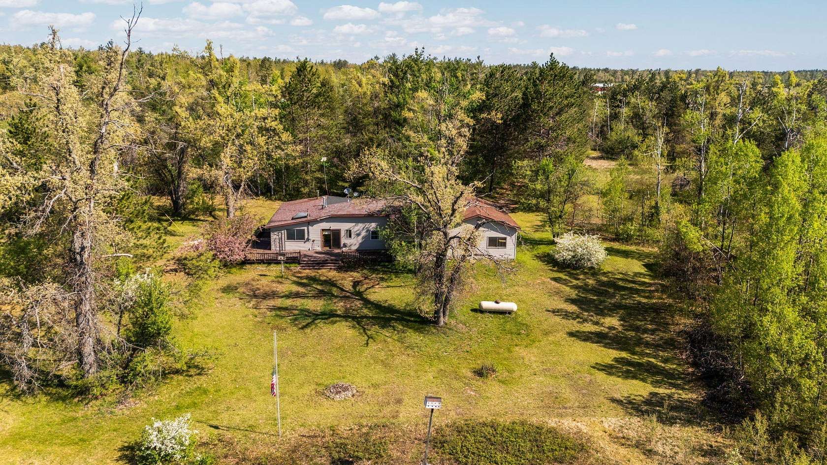 10 Acres of Recreational Land with Home for Sale in Lewiston, Michigan