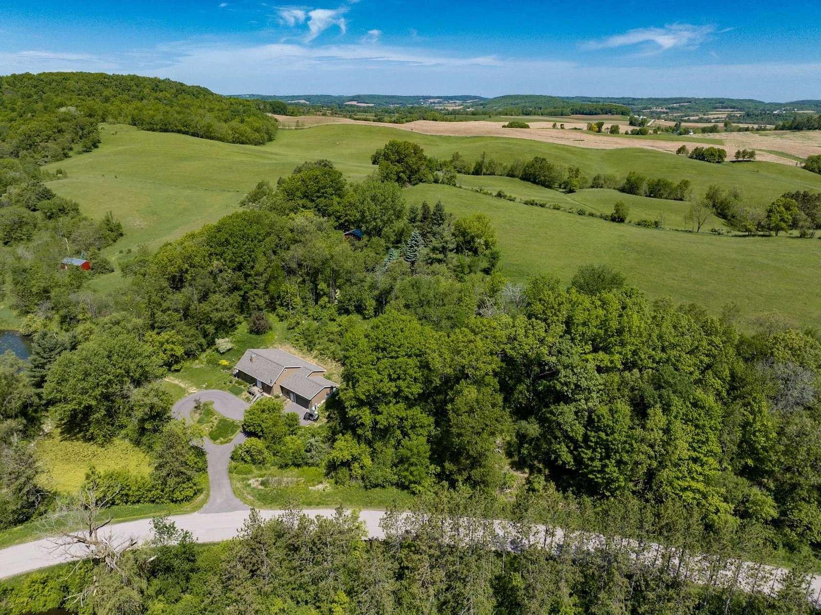 76 Acres of Agricultural Land with Home for Sale in Kendall, Wisconsin