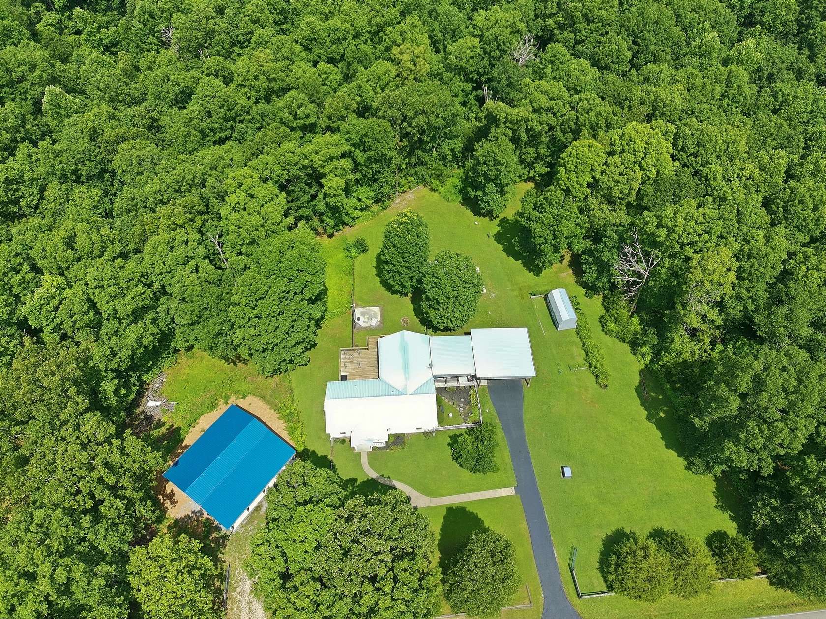 20.8 Acres of Recreational Land with Home for Sale in Summertown, Tennessee