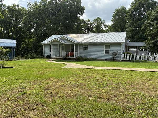 20.8 Acres of Recreational Land with Home for Sale in Summertown, Tennessee