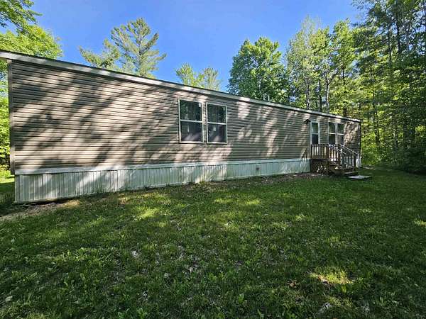 9.7 Acres of Land with Home for Sale in Harrison, Michigan