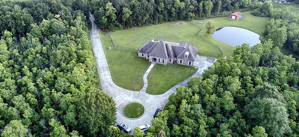 10.6 Acres of Land with Home for Sale in Scott, Louisiana