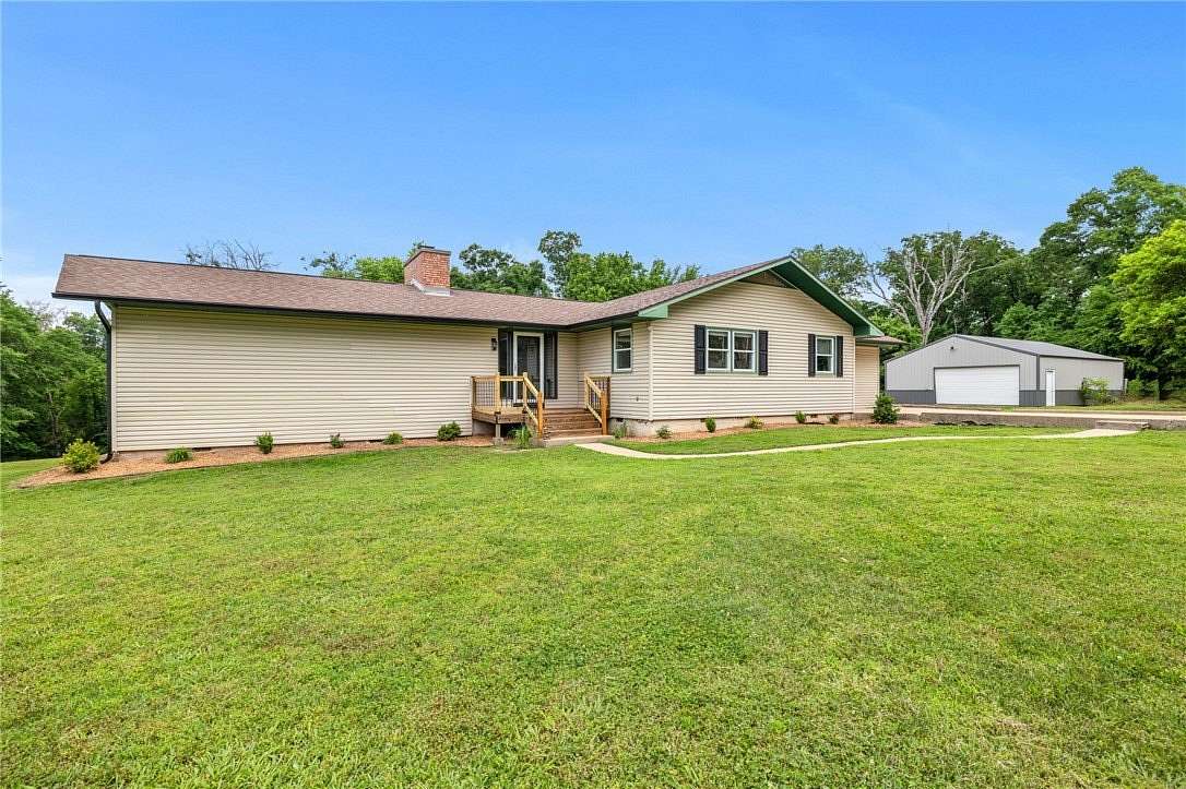 3.13 Acres of Land with Home for Sale in Gravette, Arkansas