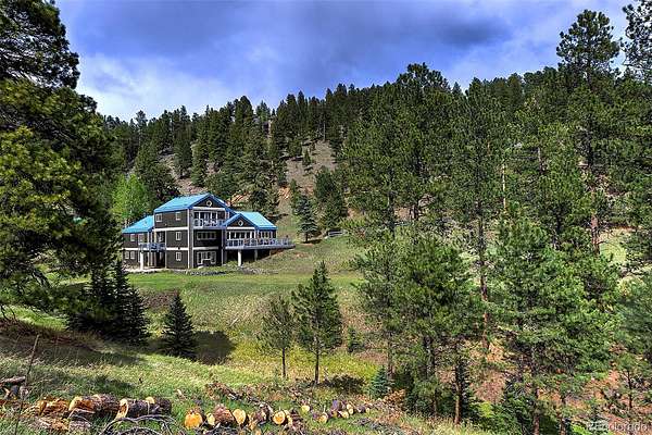 1.5 Acres of Land with Home for Sale in Evergreen, Colorado