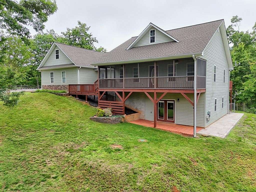 9.16 Acres of Land with Home for Sale in Warne, North Carolina