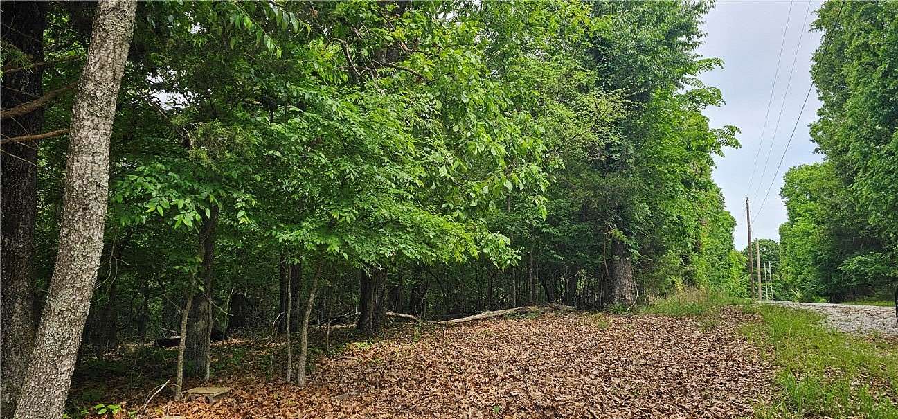 4.39 Acres of Land with Home for Sale in Lowell, Arkansas