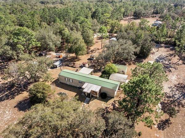 4.74 Acres of Land with Home for Sale in Williston, Florida
