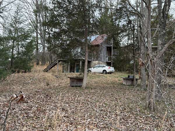 3.86 Acres of Land with Home for Sale in Lancing, Tennessee