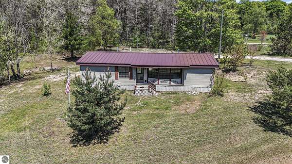 2.7 Acres of Land with Home for Sale in Bellaire, Michigan