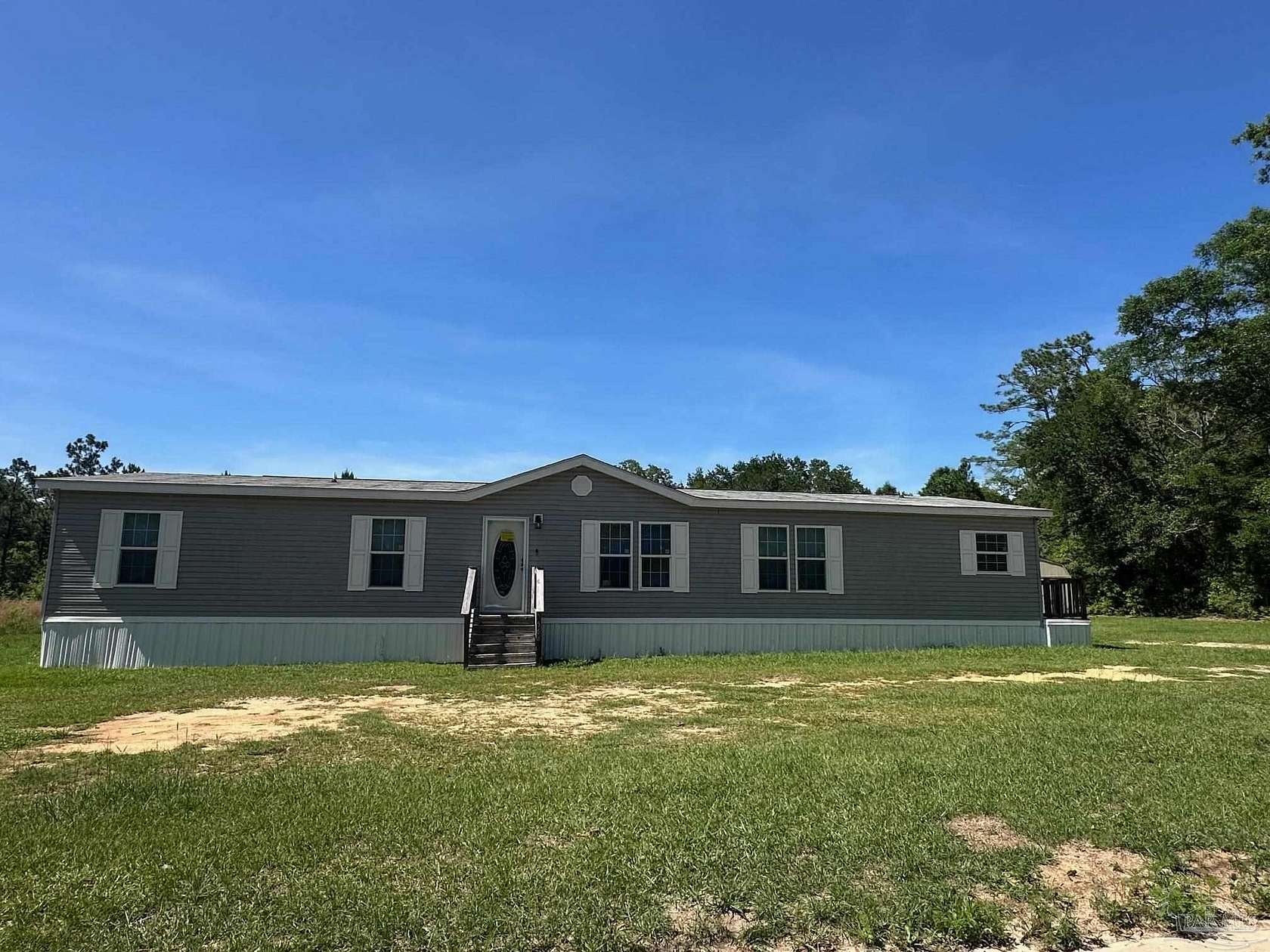 2 Acres of Land with Home for Sale in Pace, Florida