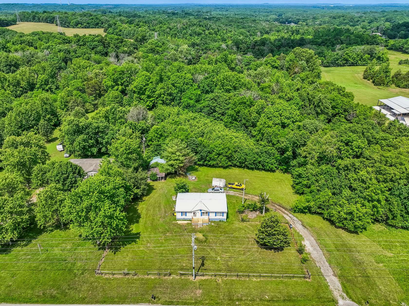 5 Acres of Land with Home for Sale in Castalian Springs, Tennessee