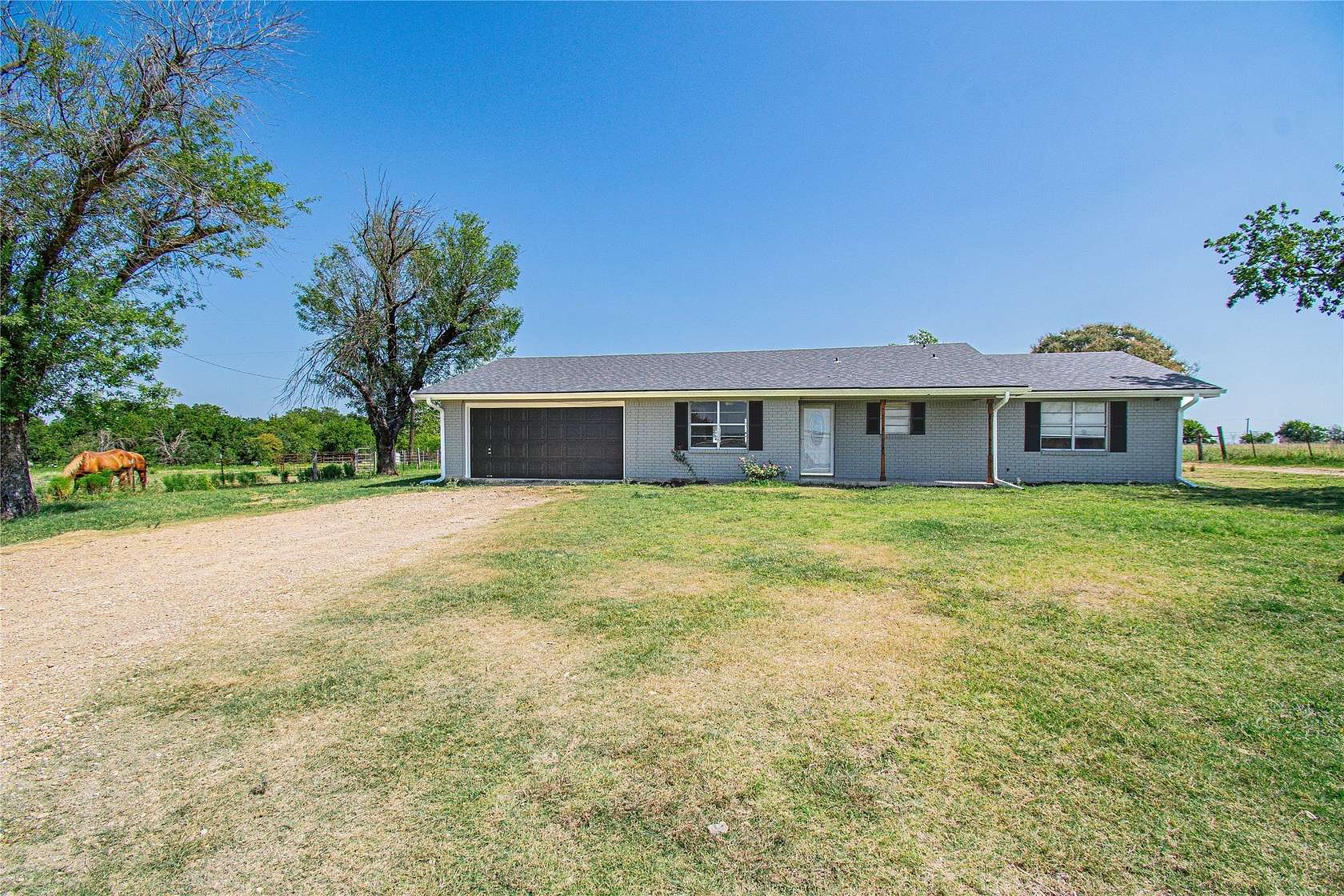 9.76 Acres of Land with Home for Sale in Rogers, Texas