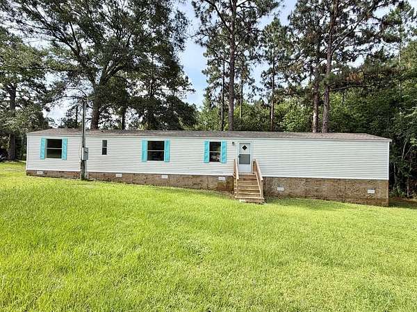 1.58 Acres of Land with Home for Sale in Carriere, Mississippi