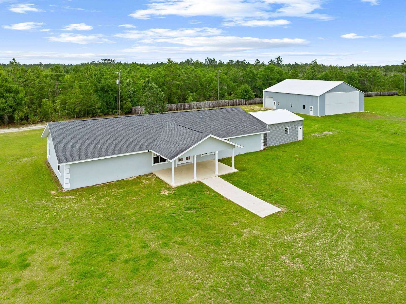 80 Acres of Agricultural Land with Home for Sale in Fountain, Florida