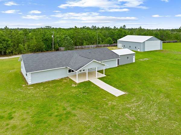 80 Acres of Agricultural Land with Home for Sale in Fountain, Florida