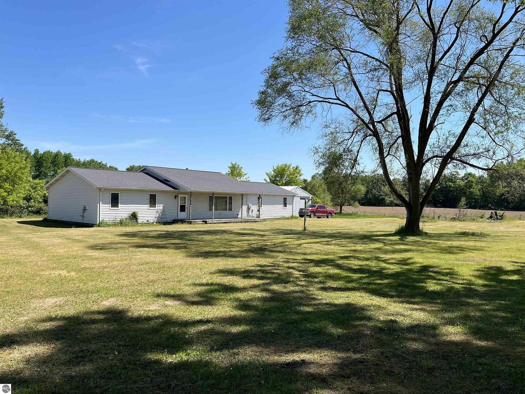 1.5 Acres of Land with Home for Sale in Six Lakes, Michigan
