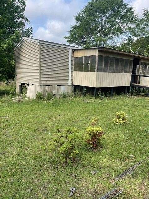 5.5 Acres of Land with Home for Sale in Bay Springs, Mississippi
