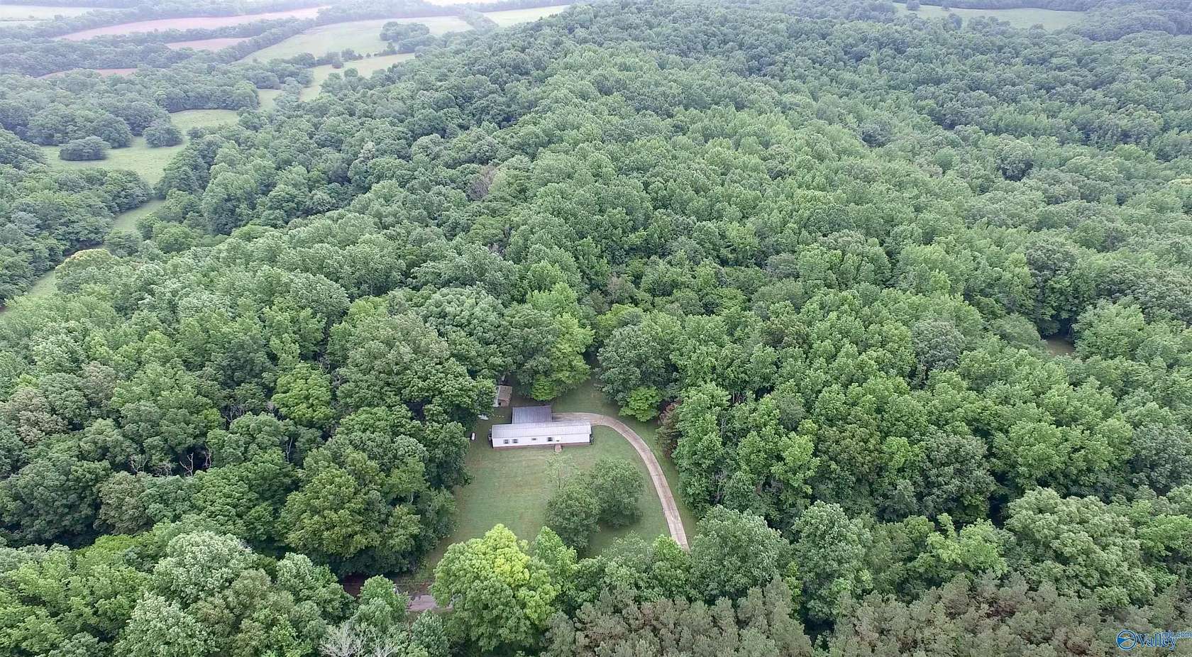9 Acres of Land with Home for Sale in Elkmont, Alabama
