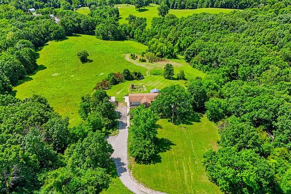 14 Acres of Land with Home for Sale in Holts Summit, Missouri