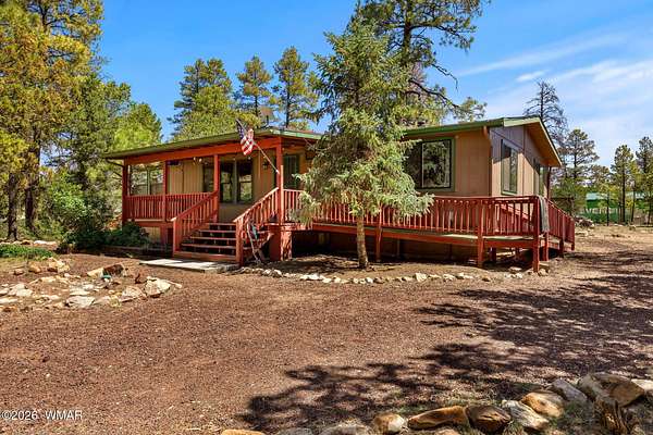1.5 Acres of Land with Home for Sale in Overgaard, Arizona