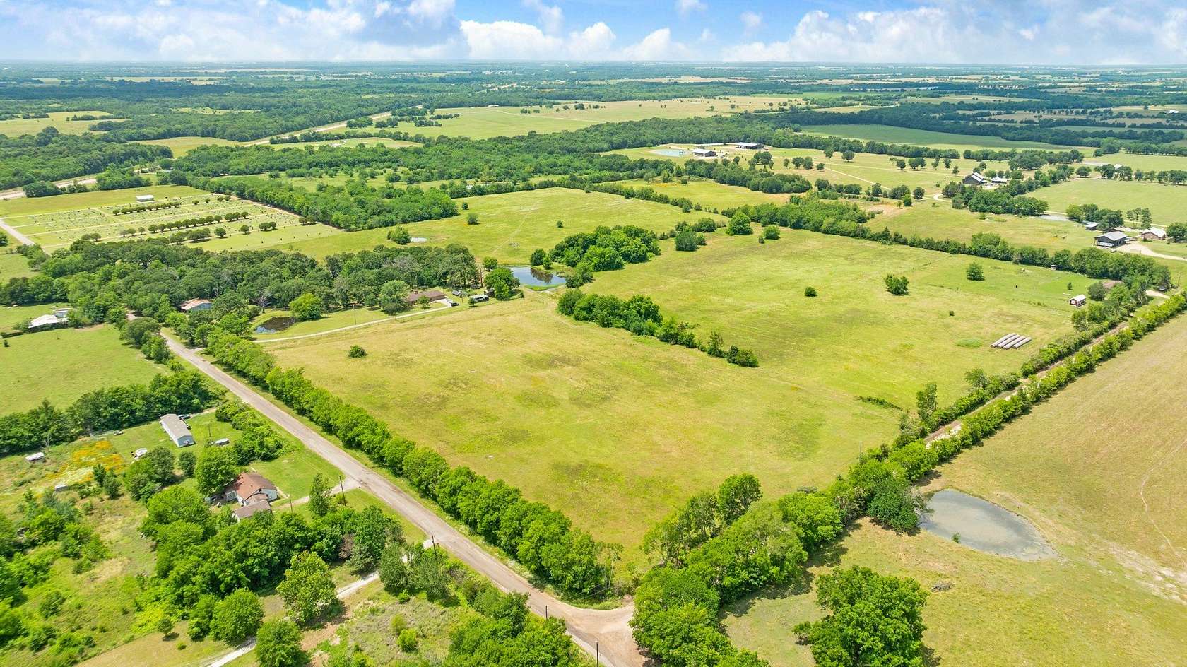 52.2 Acres of Agricultural Land with Home for Sale in Deport, Texas
