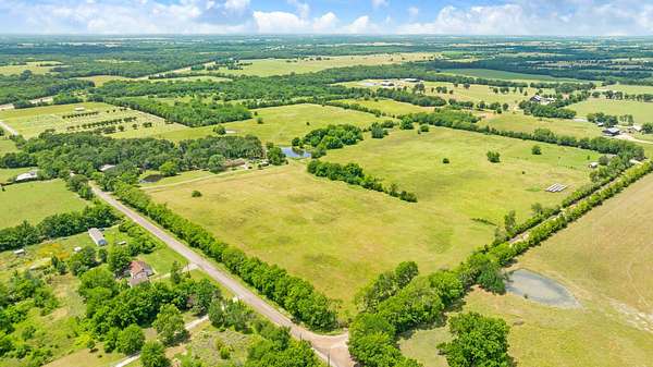 52.2 Acres of Agricultural Land with Home for Sale in Deport, Texas