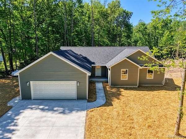 2 Acres of Land with Home for Sale in Conway Township, Michigan