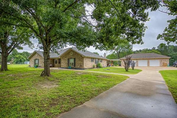 4.86 Acres of Land with Home for Sale in Elkhart, Texas