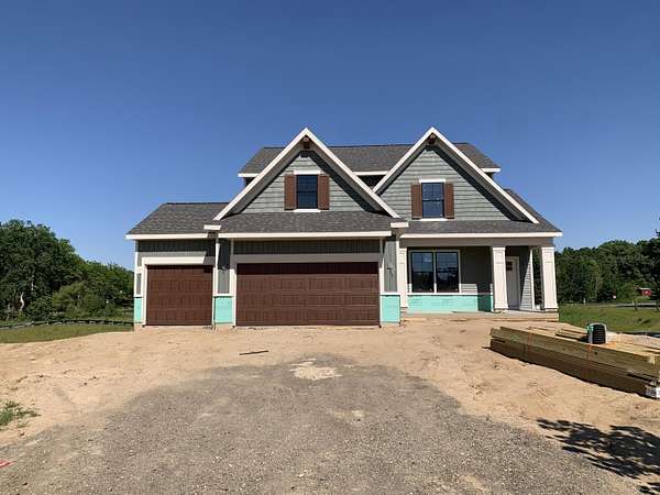 1.5 Acres of Land with Home for Sale in Rockford, Michigan