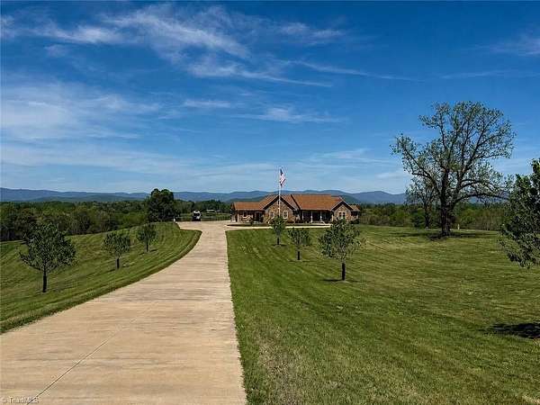 48.6 Acres of Land with Home for Sale in Roaring River, North Carolina