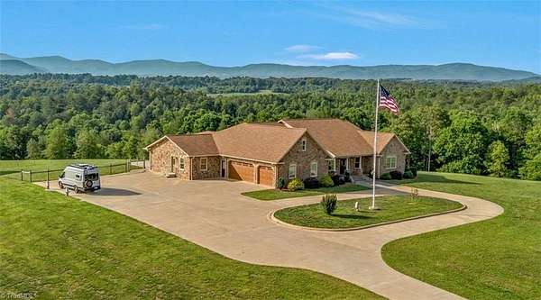 49.4 Acres of Land with Home for Sale in Roaring River, North Carolina