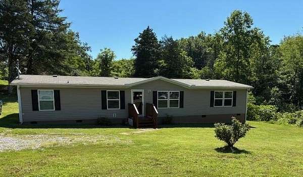 5.74 Acres of Land with Home for Sale in Kodak, Tennessee