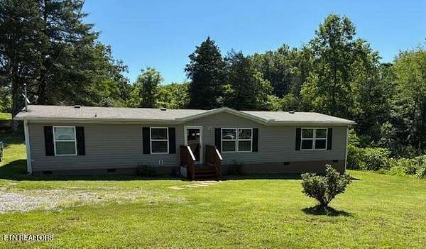 5.74 Acres of Land with Home for Sale in Kodak, Tennessee