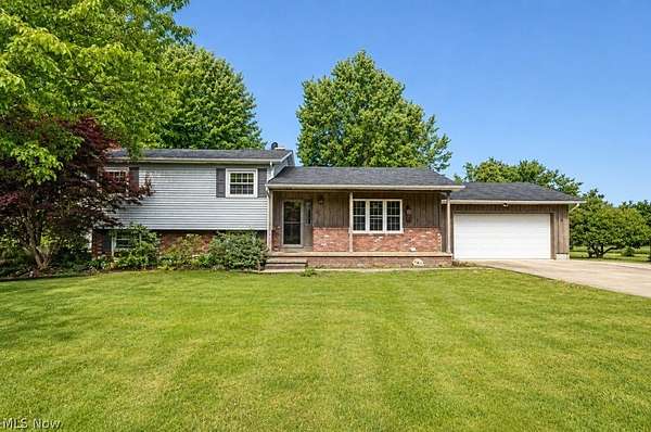5.28 Acres of Land with Home for Sale in Thompson, Ohio
