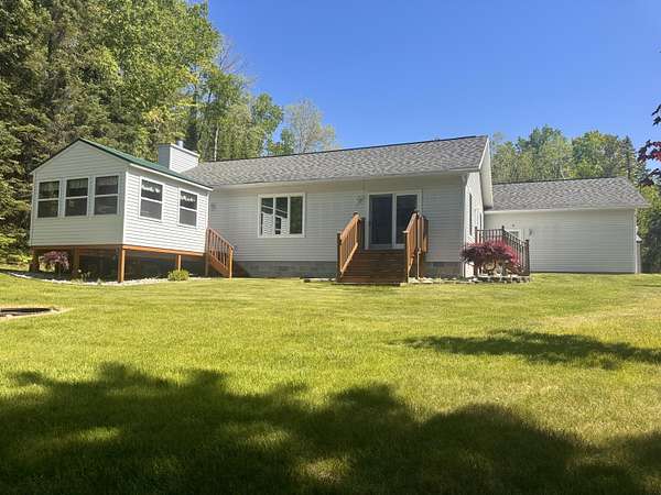 10 Acres of Recreational Land with Home for Sale in Barton City, Michigan