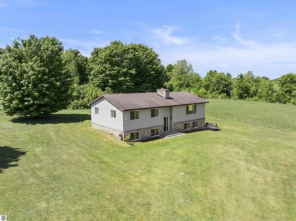 5 Acres of Land with Home for Sale in Benzonia, Michigan