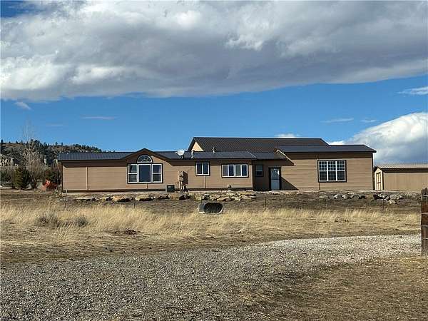 33.6 Acres of Agricultural Land with Home for Sale in Fromberg, Montana