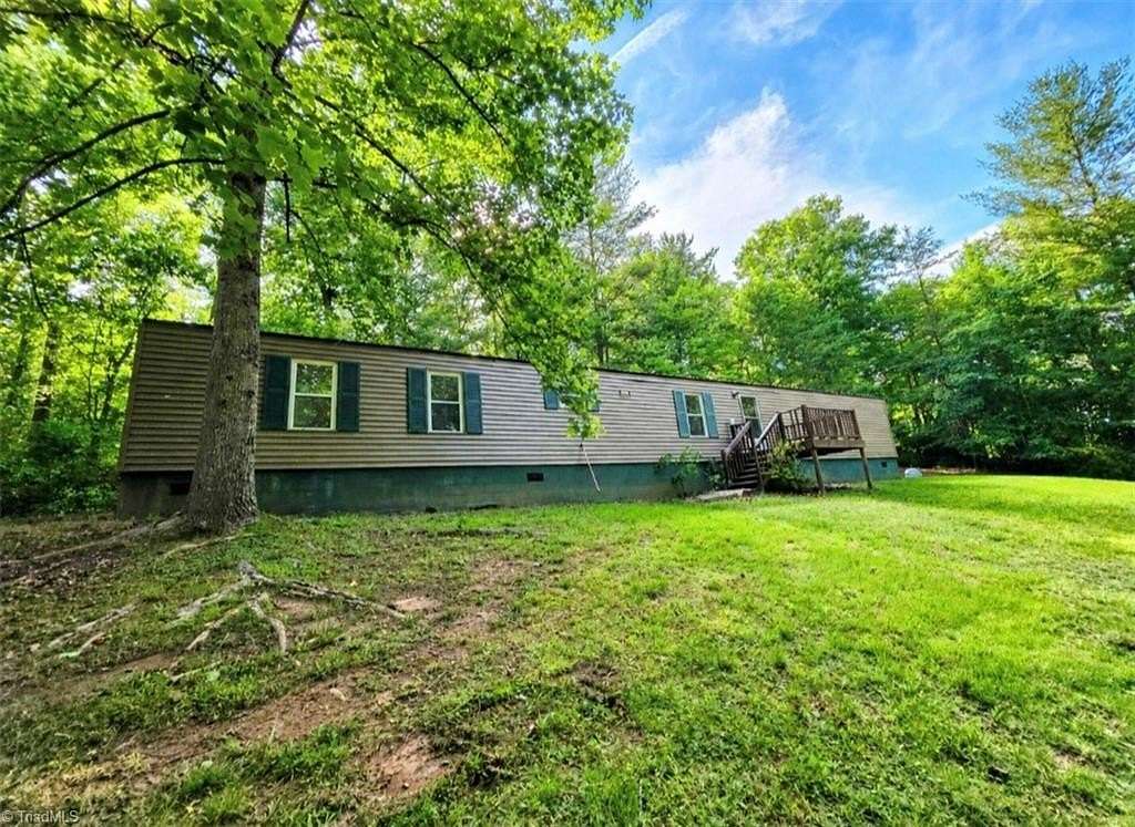 2.64 Acres of Land with Home for Sale in Millers Creek, North Carolina