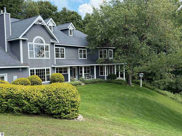 401 Acres of Land with Home for Sale in Cedar, Michigan