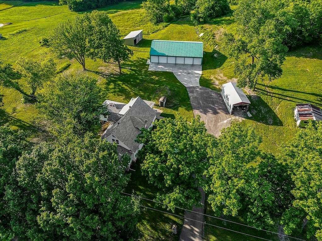 10.9 Acres of Land with Home for Sale in Buckner, Missouri