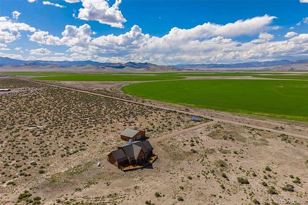 65 Acres of Recreational Land with Home for Sale in Saguache, Colorado
